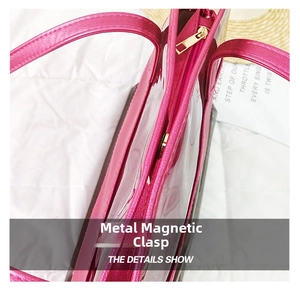 Detail of pink transparent PVC bag showing gold zipper and magnetic metal buckle closure