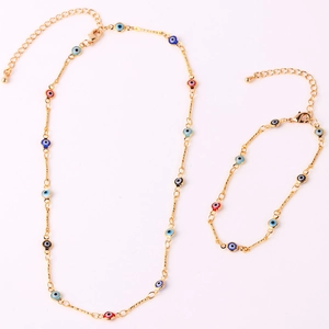 Gold plated evil eye jewelry set with colorful charms including necklace and bracelet