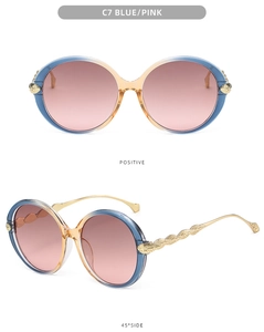 Detail of blue and pink gradient frames with gold feather textured metal temples