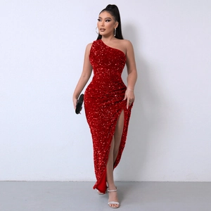 Close-up of red sequined dress showing one-shoulder design and high slit detail