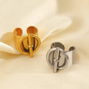 Polished stainless steel OT buckle open rings in gold and silver on silk background