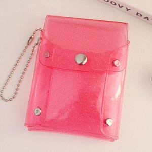 Close-up of pink glitter PVC card holder with silver snap button and bead chain strap