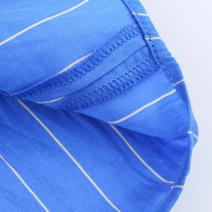 Detailed close-up of blue striped fabric showing precise double-edge stitching and texture
