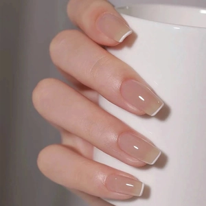 Glossy white French gradient press-on nails with nude base for elegant long manicures