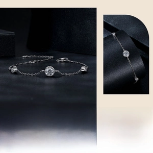 Detail view of S925 sterling silver bracelet featuring three round sparkling stones