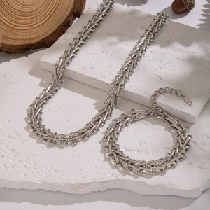 Detail of silver S925 sterling silver stamp on geometric chain necklace and bracelet
