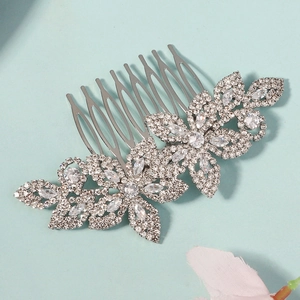 Detailed view of silver flower bridal hair comb with sparkling marquise rhinestones