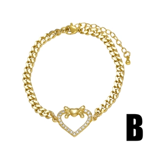 Gold-plated heart pendant bracelet with bow and zircons on a flat cuban chain