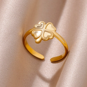 Macro shot of 18k gold plated stainless steel open ring with textured clover pattern