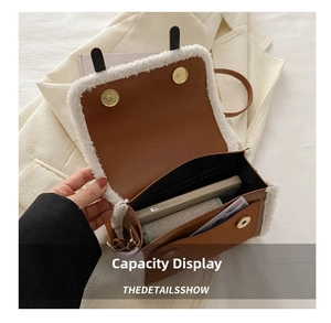 Interior view of brown leather crossbody bag with white wool trim and golden magnetic closure