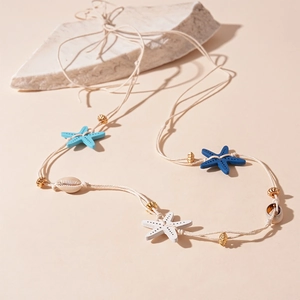 Bohemian handmade woven necklace with blue starfish pendants and natural sea shells