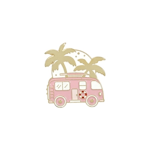 Detailed view of pink cartoon camper enamel pin with golden palm trees and beach vibes