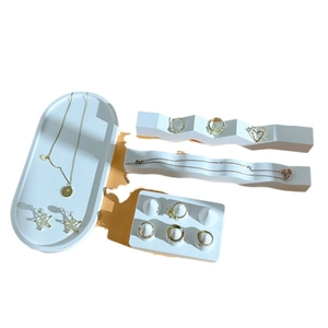 Minimalist white plaster jewelry display set with tray and ring holder for counter display