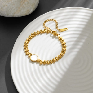 Elegant gold titanium steel bracelet with heart links and white shell inlay on stone