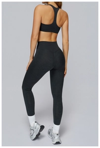 Detail of dark grey marl yoga set featuring high-waist leggings and racerback sports bra