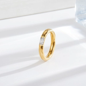 Minimalist gold titanium steel ring with rectangular zirconia and polished dome band