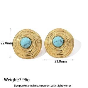 Detail of bohemian round stud earrings with turquoise stones and spiral gold texture