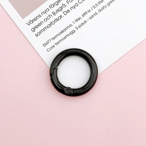 Detail of 25mm round spring ring gate with glossy black paint finish for DIY accessories