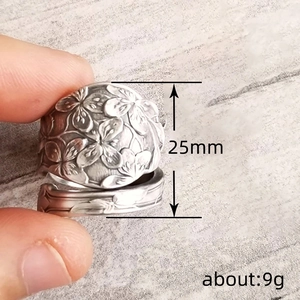 Vintage oxidized silver wide band ring with embossed floral patterns for women