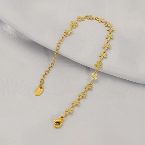 Detail of gold floral link bracelet with blue enamel petals and adjustable lobster clasp