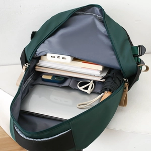 Deep green large capacity student backpack with organized internal storage for laptops