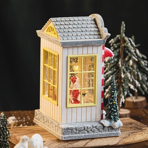 Christmas musical snow globe with Santa Claus and warm glowing LED lights