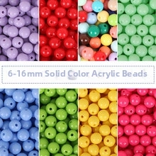 Macro view of colorful solid acrylic round beads in sizes 6mm to 16mm for DIY jewelry