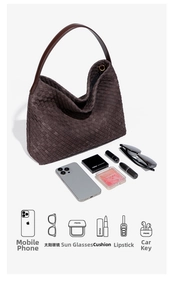 Macro shot of dark brown woven tote showing spacious capacity for phone and cosmetics