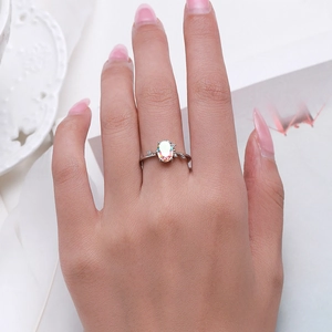 Elegant S925 sterling silver ring with oval opal gemstone on a hand for women