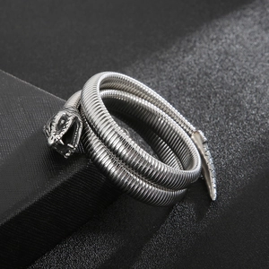 Macro detail of antique silver snake-shaped multi-layered bracelet with realistic scales
