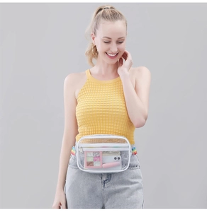Close-up of a clear PVC waist bag with adjustable strap showing internal storage space