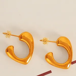Polished 18K gold C-shaped heart earrings for women including steel and silicone backs