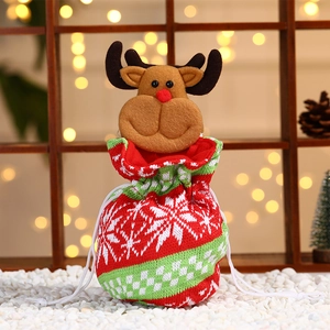 Christmas reindeer knit drawstring gift bag with snowflake patterns and plush decor