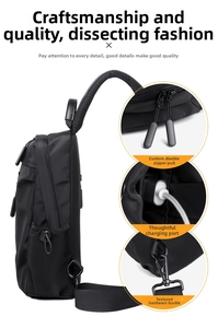 Detail of crossbody bag with dual zippers, USB charging port and metal buckle hardware