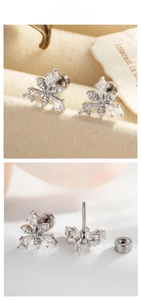 Macro detail of snowflake stud earrings with clear zircon inlays and screw back closure