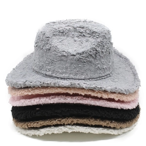 Detailed stack of multi-color plush cowboy hats in faux fur with soft texture