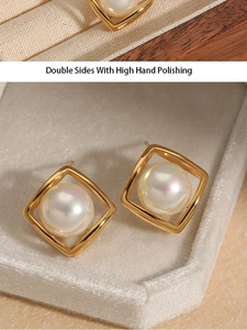 Detail of square gold plated steel earrings with pearls and high hand polishing finish