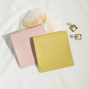 Pink and yellow PU leather pouches with stitching for jewelry storage and organization