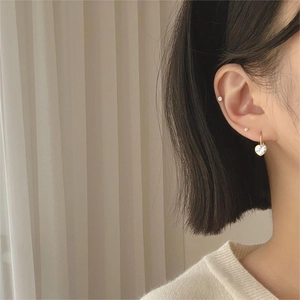 925 sterling silver gold heart drop earrings with zircon crystals on model's ear