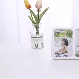 Modern white triple picture frame with minimalist design and fresh floral home decor