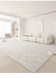 Detail view of cream waterproof carpet with black ink dots and fine stitched edges
