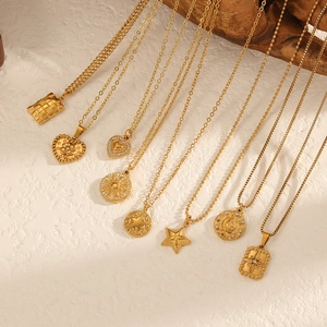 18K gold plated stainless steel necklaces with star and moon pendants on a light background