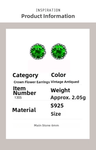 Detail view of vintage S925 silver emerald earrings with retro floral cross stud design