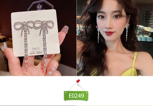 Silver bow earrings with long tassel dangles and sparkling geometric crystals for women