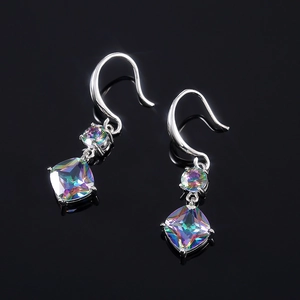 Macro detail of silver drop earrings with rainbow princess-cut cubic zirconia and glossy finish