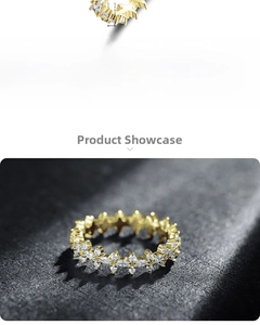 Detail of 925 sterling silver gold-plated ring with star patterns and marquise zircons
