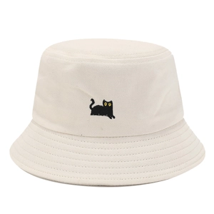 Beige bucket hat with cute black cat embroidery and yellow eyes on white background