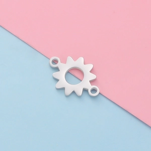 Close-up of polished silver steel sunflower gear connector for DIY jewelry making
