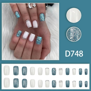 Blue and cream press-on nails set with glitter powder and rhinestone accents in square shape