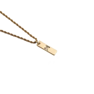 Gold twist chain necklace with a rectangular pendant featuring colorful zircon letter M